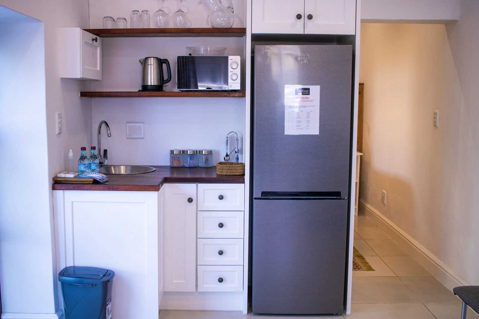 Kitchenette with fridge-freezer, kettle and microwave